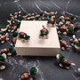 Cowrie Shell Sea Turtle Figurines Green Hat (3 figures approx. 2+ inches) Cute Cowrie Seashell Sea Turtles for gifts decor & display! Copyright 2025 SeaShellSupply.com