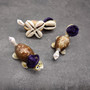 Cowrie Shell Sea Turtle Figurines Purple Hat (3 figures approx. 2+ inches) Cute Cowrie Seashell Sea Turtles for gifts decor & display! Copyright 2025 SeaShellSupply.com.