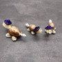 Cowrie Shell Sea Turtle Figurines Purple Hat (3 figures approx. 2+ inches) Cute Cowrie Seashell Sea Turtles for gifts decor & display! Copyright 2025 SeaShellSupply.com.