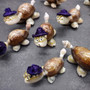 Cowrie Shell Sea Turtle Figurines Purple Hat (3 figures approx. 2+ inches) Cute Cowrie Seashell Sea Turtles for gifts decor & display! Copyright 2025 SeaShellSupply.com.