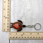 Orange Hibiscus Painted Wooden Sea Turtle Keychain (1 keychain approx. 4.25+ inches) Wooden Sea Turtle Key Fob for gifting or party favors! Copyright 2025 SeaShellSupply.com.
