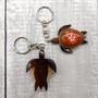 Orange Hibiscus Painted Wooden Sea Turtle Keychain (1 keychain approx. 4.25+ inches) Wooden Sea Turtle Key Fob for gifting or party favors! Copyright 2025 SeaShellSupply.com.