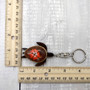 Orange Hibiscus Painted Wooden Sea Turtle Keychain (1 keychain approx. 4.25+ inches) Wooden Sea Turtle Key Fob for gifting or party favors! Copyright 2025 SeaShellSupply.com.