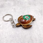 Green Hibiscus Painted Wooden Sea Turtle Keychain (1 keychain approx. 4.25+ inches) Wooden Sea Turtle Key Fob for gifting or party favors! Copyright 2025 SeaShellSupply.com.