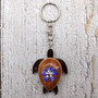Purple Hibiscus Painted Wooden Sea Turtle Keychain (1 keychain approx. 4.25+ inches) Wooden Sea Turtle Key Fob for gifting or party favors! Copyright 2025 SeaShellSupply.com.