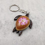 Pink Hibiscus Painted Wooden Sea Turtle Keychain (1 keychain approx. 4.25+ inches) Wooden Sea Turtle Key Fob for gifting or party favors! Copyright 2025 SeaShellSupply.com.