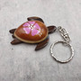 Pink Hibiscus Painted Wooden Sea Turtle Keychain (1 keychain approx. 4.25+ inches) Wooden Sea Turtle Key Fob for gifting or party favors! Copyright 2025 SeaShellSupply.com.