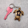 Stylized Woodburned Sea Turtle Keychain (1 keychain approx. 4+ inches) Burnt Wooden Sea Turtle Key Fob for gifting or decorative charm! Copyright 2025 SeaShellSupply.com.