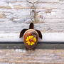 Yellow Hibiscus Painted Wooden Sea Turtle Keychain (1 key fob approx. 4.25+ inches) Wooden Sea Turtle Keychain for gifting or party favors! Copyright 2025 SeaShellSupply.com.