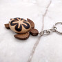 Natural Wood Plumeria Sea Turtle Keychain (1 key chain approx. 4+ inches) Wooden Pattern Sea Turtle Key Fob for gifting or decorative charm! Copyright 2025 SeaShellSupply.com.