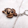 Natural Wood Plumeria Sea Turtle Keychain (1 key chain approx. 4+ inches) Wooden Pattern Sea Turtle Key Fob for gifting or decorative charm! Copyright 2025 SeaShellSupply.com.