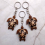 Natural Wood Plumeria Sea Turtle Keychain (1 key chain approx. 4+ inches) Wooden Pattern Sea Turtle Key Fob for gifting or decorative charm! Copyright 2025 SeaShellSupply.com.