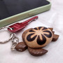 Natural Wood Plumeria Sea Turtle Keychain (1 key chain approx. 4+ inches) Wooden Pattern Sea Turtle Key Fob for gifting or decorative charm! Copyright 2025 SeaShellSupply.com.