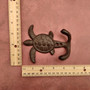Cast Iron Sea Turtle Wall Hooks Brown Patina (1 metal hook approx. 4.75+ inches) Brown Sea Turtle Double Wall Hook for coastal decor! Copyright 2025 SeaShellSupply.com.