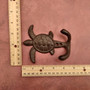 Cast Iron Sea Turtle Wall Hooks Brown Patina (1 metal hook approx. 4.75+ inches) Brown Sea Turtle Double Wall Hook for coastal decor! Copyright 2025 SeaShellSupply.com.