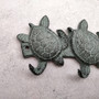 Sea Turtle Family Wall Hook Rack Cast Iron Green Patina (1 hook rack approx. 10 inches) Green Sea Turtle Hook Rack for coastal decor!  Copyright 2025 SeaShellSupply.com.