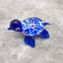 Swirl Glass Sea Turtle Figurine Blue (1 sea turtle figure approx. 1.5 inches) Swirly Blue Glass Sea Turtle for gifts décor & collecting! Copyright 2025 SeaShellSupply.com.