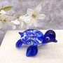 Swirl Glass Sea Turtle Figurine Blue (1 sea turtle figure approx. 1.5 inches) Swirly Blue Glass Sea Turtle for gifts décor & collecting! Copyright 2025 SeaShellSupply.com.