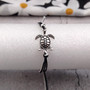 Sea Turtle Charm Bracelet Black Grey White Cord (approx. 5-7+ inches AROUND) Black Grey Sea Turtle String Bracelet Jewelry for gifting! Copyright 2025 SeaShellSupply.com.