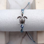 Sea Turtle Charm Bracelet Dark and Light Blue White Cord (approx. 5-7+ inches AROUND) Navy and Baby Blue Sea Turtle String Bracelet to gift! Copyright 2025 SeaShellSupply.com.