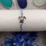 Sea Turtle Bracelet Braided Cord Light Blue Purple White (approx. 5-7+ inches AROUND) Blue Purple String Sea Turtle Bracelet to gift! Copyright 2025 SeaShellSupply.com.