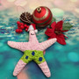 Pink Cartoon Starfish Christmas Ornament (1 Seastar approx. 4+ inches) Hanging Xmas Tree Starfish Ornament for gifting & holiday decor! Copyright 2025 SeaShellSupply.com.