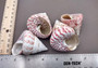 Strawberry Trochus Seashells - Techtus Conus - (4 shells approx. 1.5-2.5 inches). Four spiral pink and purple shells laid out to show the different angles. Copyright 2024 SeaShellSupply.com.