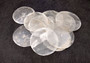 Capiz Shells - (10 shells 2 inch Round Cut). Multiple semi translucent shells in small pile. Copyright 2024 SeaShellSupply.com.