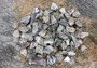 Pink Abalone Chips (approx. 90-110 chips 0.25-1 inches) multiple pieces some spotted, some smooth in a pile. Copyright 2022 SeaShellSupply.com