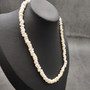 White Puka Shell Necklace - (1 necklace 18 inches x 4-5mm) on grey background. Copyright 2026 SeaShellSupply.com.
