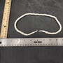 White Puka Shell Necklace - (1 necklace 18 inches x 4-5mm) on grey background. Copyright 2026 SeaShellSupply.com.

