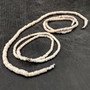 White Puka Shell Necklace - (1 necklace 18 inches x 4-5mm) on grey background. Copyright 2026 SeaShellSupply.com.
