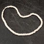 White Puka Shell Necklace - (1 necklace 18 inches x 4-5mm) on grey background. Copyright 2026 SeaShellSupply.com.
