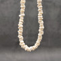 White Puka Shell Necklace - (1 necklace 18 inches x 4-5mm) on grey background. Copyright 2026 SeaShellSupply.com.
