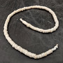 White Puka Shell Necklace - (1 necklace 18 inches x 4-5mm) on grey background. Copyright 2026 SeaShellSupply.com.
