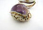 Purple Top Tiger Cowrie (2 shells approx. 2.25-3 inches). Two shells, one showing the purple ombre side and one showing the opening. Copyright 2022 SeaShellSupply.com.