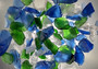 Beach Glass - Large Tumbled Rough Blue, Green & White Assorted - (approx. 1 Kilogram/2.2 lbs. .5-1.75 inches). Multiple different colored pebbles in a pile. Copyright 2022 SeaShellSupply.com.