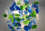 Beach Glass - Large Tumbled Rough Blue, Green & White Assorted - (approx. 1 Kilogram/2.2 lbs. .5-1.75 inches). Multiple different colored pebbles in a pile. Copyright 2022 SeaShellSupply.com.