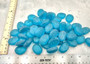 Beach Glass - Rounded Aqua Blue Pebbles - (approx. 1 Kilogram/2.2 lbs. 1-1.5 inches). Multiple smooth blue glass pebbles in a pile. Copyright 2025 SeaShellSupply.com.