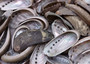 Natural Mule Ear Abalone - Haliotis Asiana - (10 shells approx. 1.5+"). Multiple brown wide open shells with holes along one edge. Copyright 2025 SeaShellSupply.com.
