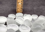 Beach Glass - Rounded Clear-White Frosted Pebbles - (approx. 1 Kilogram/2.2 lbs. 1-1.5 inches). Multiple lightly colored shells in a pile. Copyright 2025 SeaShellSupply.com.