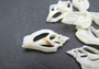 White Center Cut Strombus Variabilis - (10 shells approx. 1-1.5 inches). Multiple white spiral thinly cut shells with openings along the inside. Copyright 2022 SeaShellSupply.com.