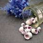 Cebu Beauty/Violet Coral Seashells - Coralliophila Neritoidea - (approx. 40-50 pcs.). Multiple purple and cream spiral shells. Copyright 2022 SeaShellSupply.com.