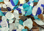 Beach Glass - Medium Tumbled Rough Brown, White & Blue Pacific Assorted - (approx. 1 Kilogram/2.2 lbs. .5-1.25 inches). Multiple blue, white, and brown fragments in a pile. All different shapes and sizes. Copyright 2025 SeaShellSupply.com.