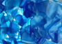 Beach Glass - Medium Tumbled Rough Cobalt Blue - (approx. 1 Kilogram/2.2 lbs. .5-1.25 inches). Multiple shaded blue tiles in a pile, all are different sizes and shapes. Copyright 2025 SeaShellSupply.com.