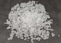 Beach Glass - Small Tumbled Rough Frosty White - (approx. 1 Kilogram/2.2 lbs. .25-1 inches). Multiple stone pebbles in a pile. Copyright 2022 SeaShellSupply.com.