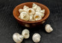 Pearlized Turbo Seashells (10 pcs.). Pile of spiral white glazed shells with medium sized openings. Copyright 2025 SeaShellSupply.com.