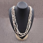 White Nassa Shell Leis (3 Leis Approx. .25 x 28 Inches). White little shells strung through string. Copyright 2026 SeaShellSupply.com.