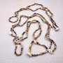Natural Nassa Shell Leis (3 Leis Approx. .25 x 17 Inches each). Two Different assortment of shells on a necklace brown and tan grouping.Copyright 2026 SeaShellSupply.com.