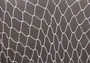 White Decorative Fish Net - (1 Net approx. 3.3 feet x 6.6 feet) on greyish background. Copyright 2022 SeaShellSupply.com.